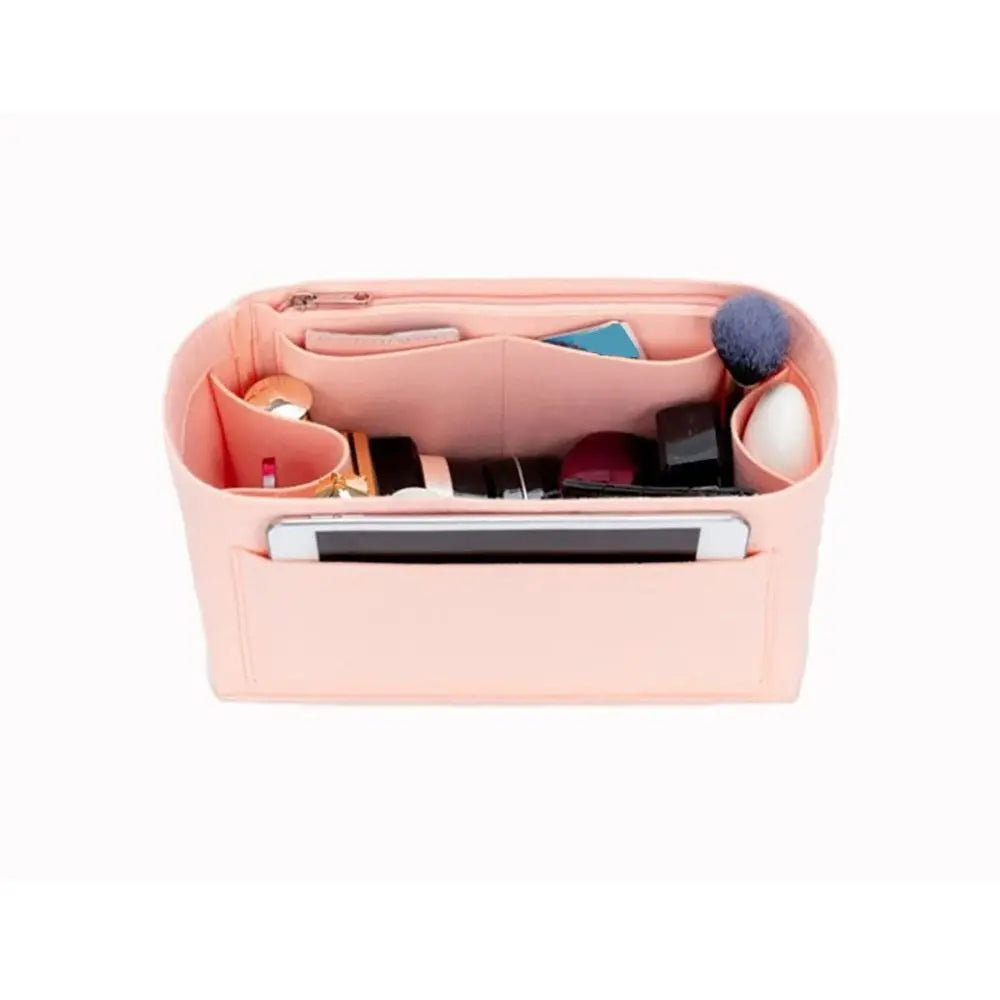 A pink felt purse organizer insert showing various small accessories and compartments.