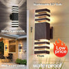 Modern black LED wall sconce with white light, featuring replaceable E27 bulb and waterproof design.