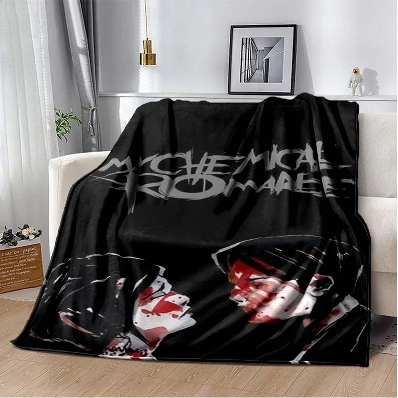 A black fleece throw blanket featuring a graphic design of the My Chemical Romance band.