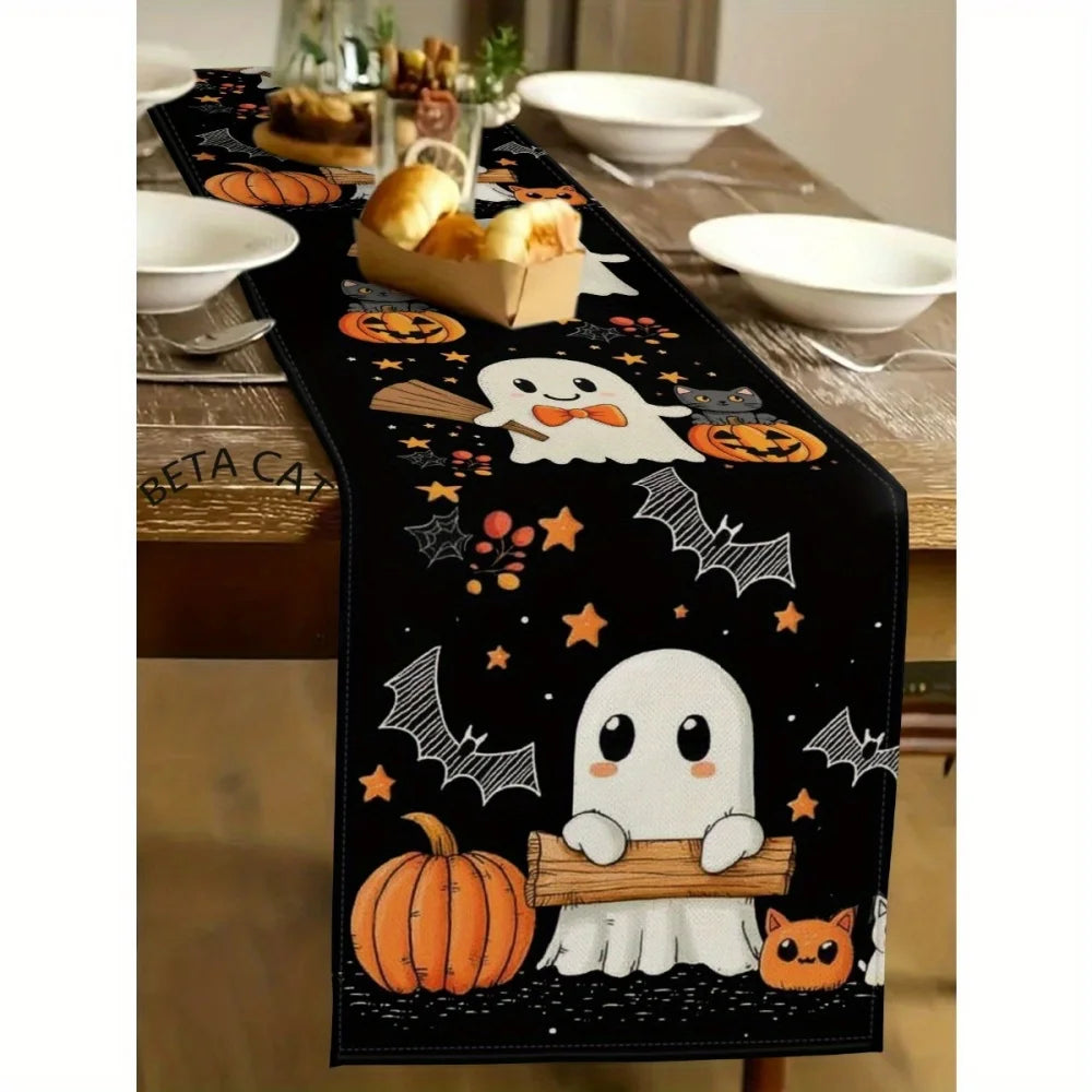 Black Halloween table runner featuring pumpkins, bats, and jack-o'-lanterns