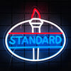A neon sign shaped like a truck emblem with the word STANDARD glowing blue and red on a dark background.