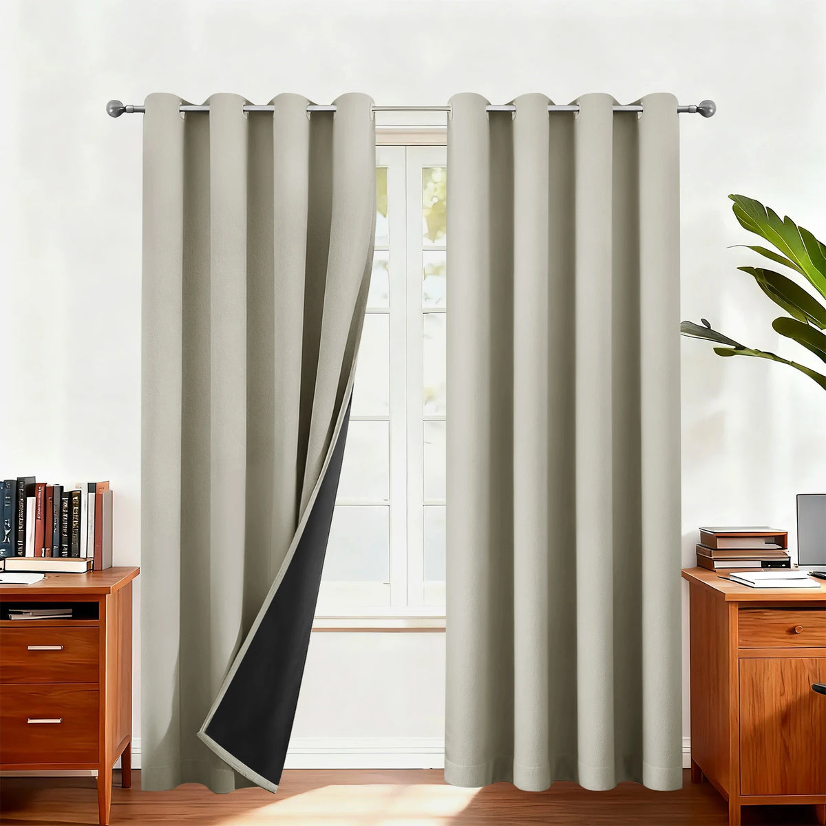 Light beige double-layer blackout curtains hanging in a window frame.