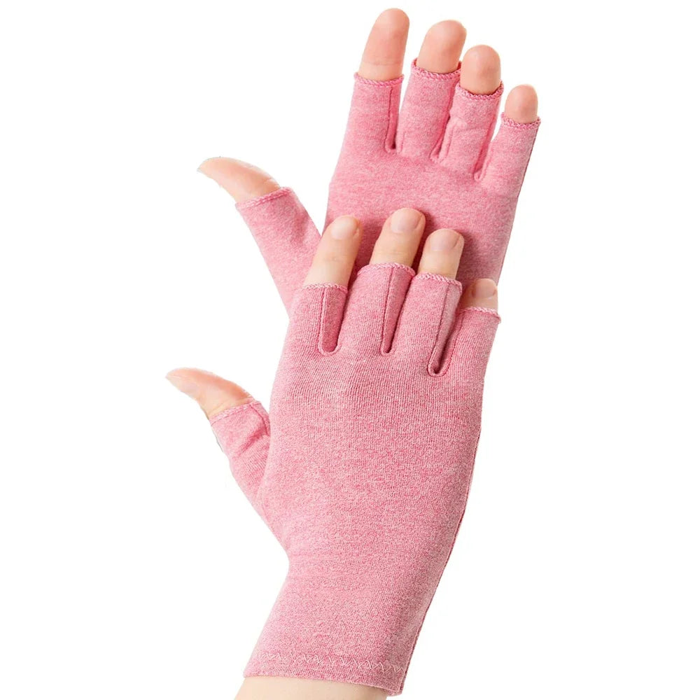 A close-up of a pink fingerless compression glove worn on a hand.