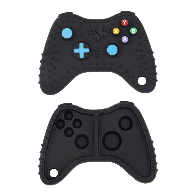 A black silicone baby teether toy shaped like a remote control with various buttons and holes.