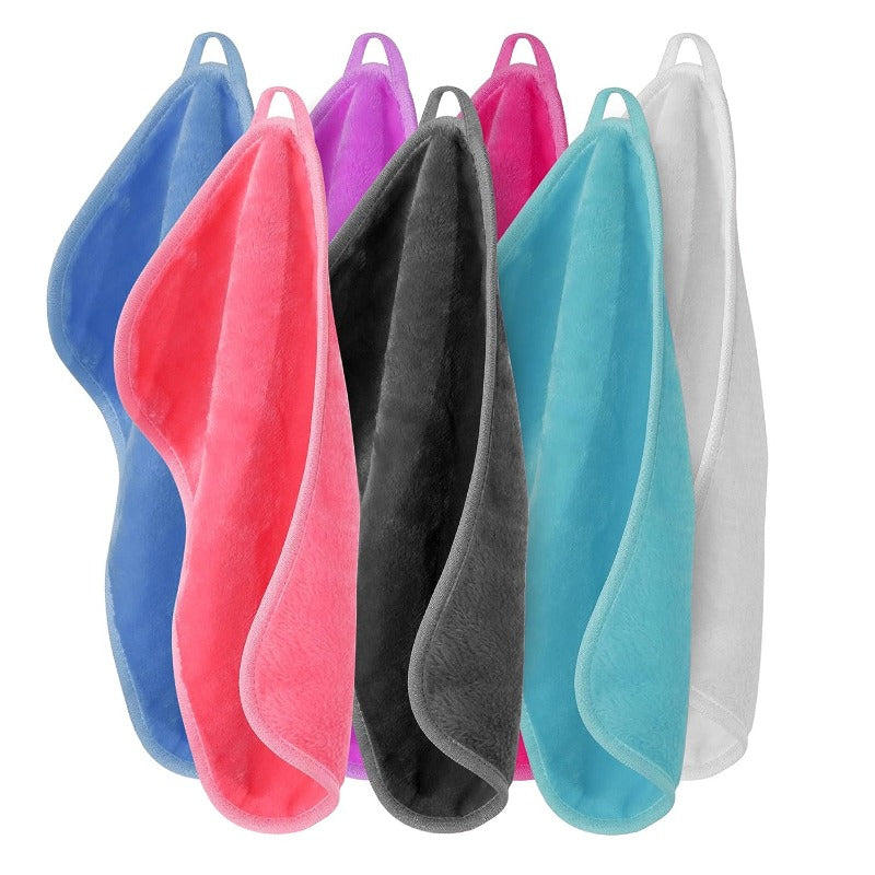 A set of five reusable makeup remover cloths in various bright colors including pink, purple, teal, and gray.