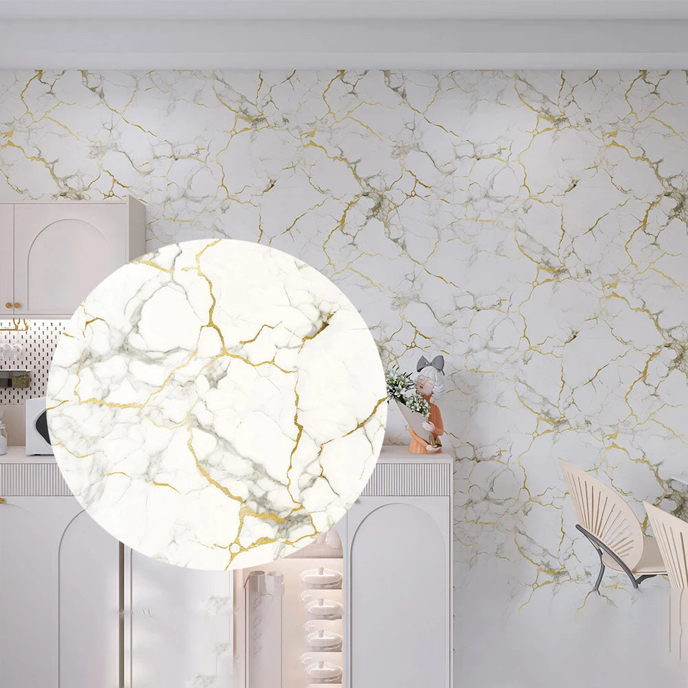 Marble effect peel-and-stick wallpaper covering a kitchen wall with white and gold veining.