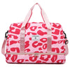Pink leopard print duffle bag with pink straps and a zippered compartment