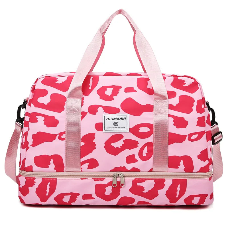 Pink leopard print duffle bag with pink straps and a zippered compartment