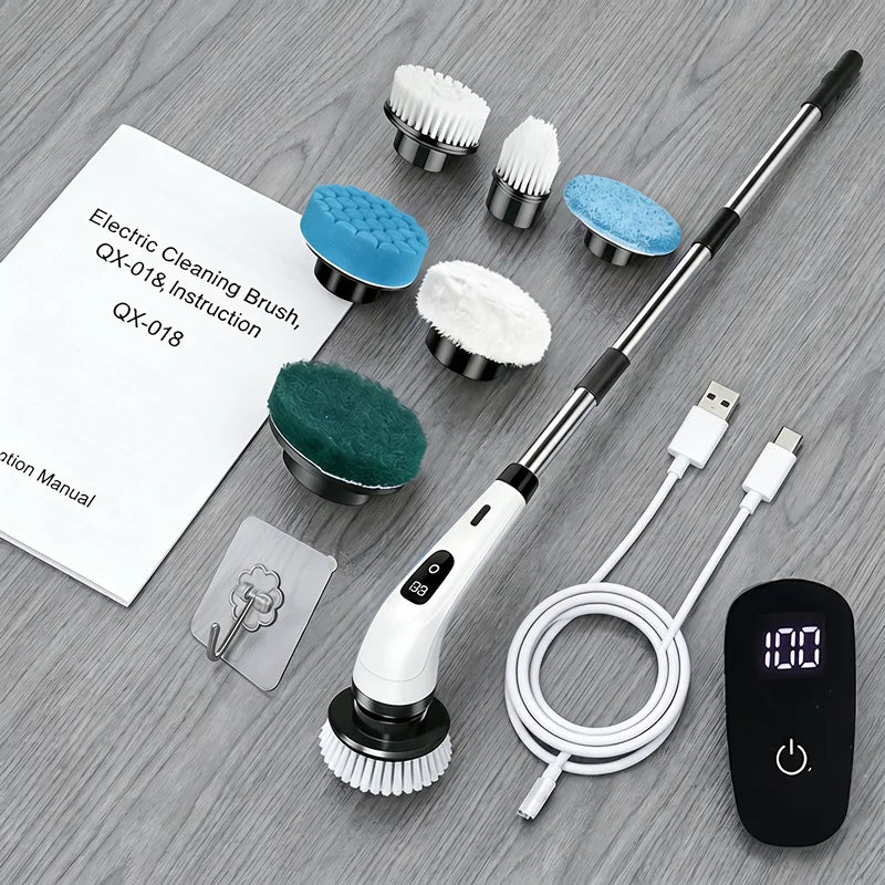 Cordless electric cleaning brush set with interchangeable heads and charging base on a gray surface.