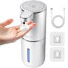 A white touchless automatic soap dispenser is shown dispensing soap onto a hand, with charging cables and battery indicators 