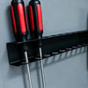 Two black and red wall-mounted tool organizers with metal rods for holding tools.