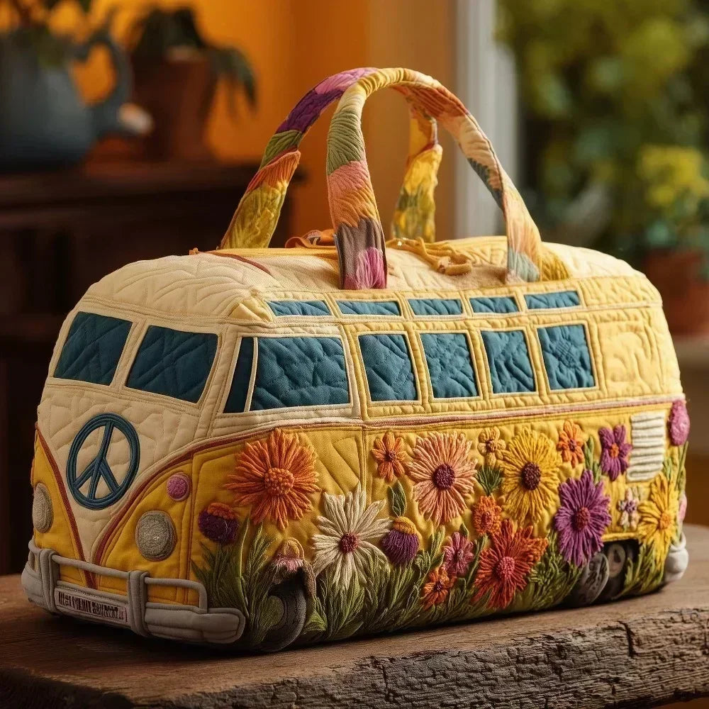 A quilted travel duffle bag featuring a yellow exterior decorated with colorful floral embroidery and striped handles.