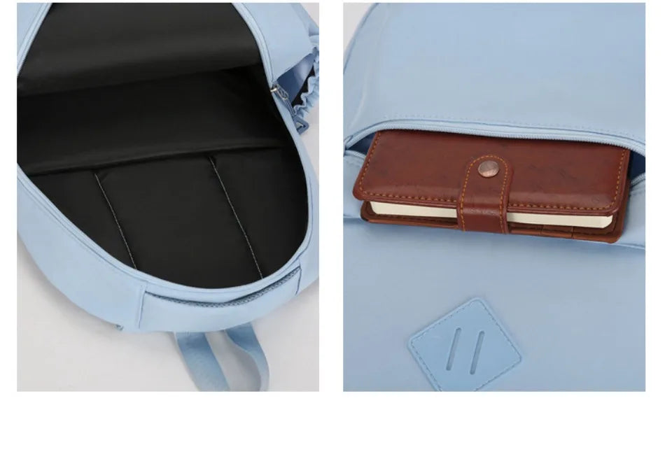 A light blue nylon backpack showing the interior compartment and an exterior leather wallet.