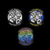 Three round patches featuring the archangel Saint Michael with a sword and the text Protect Us on black and blue backgrounds.