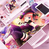 Anime character illustration of Nino Nakano on a mouse pad featuring pink and purple tones