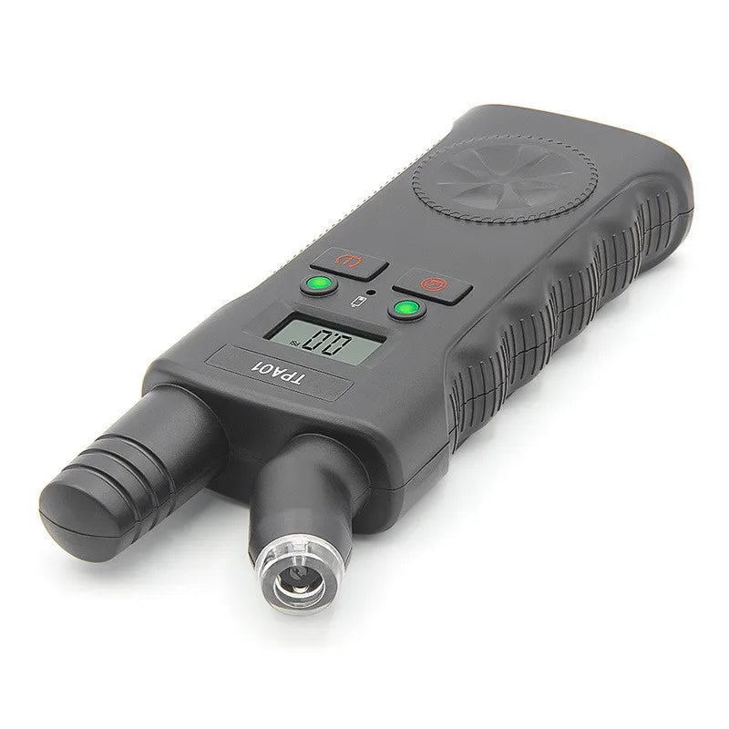 A black TPMS relearn tool with a digital tire pressure gauge is shown from above.