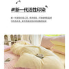 A close-up of a pink and white checkered duvet cover set with two pillowcases on a bed.