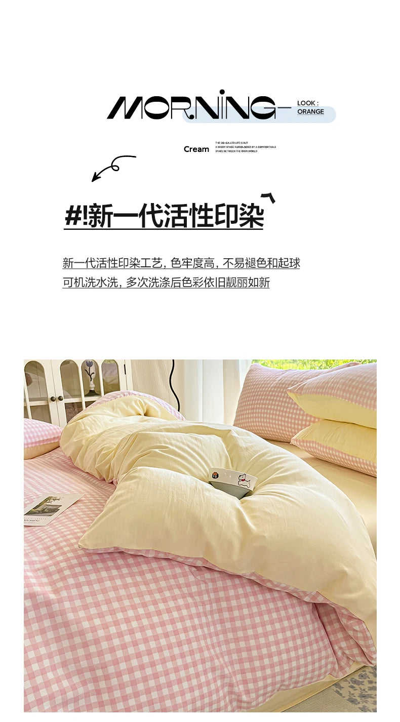 A close-up of a pink and white checkered duvet cover set with two pillowcases on a bed.