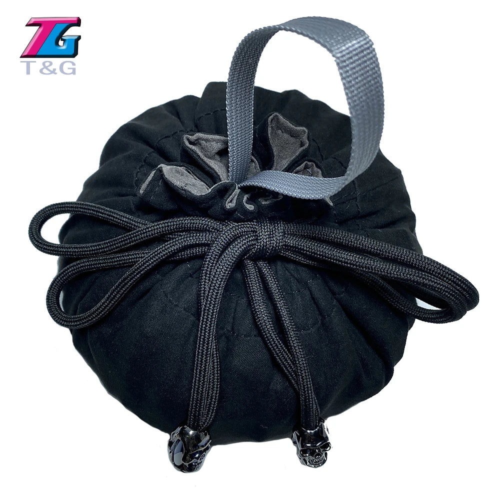 Black velvet dice storage pouch with a drawstring and silver-colored loop.