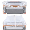 A universal baby mosquito net cover for bassinets, cribs, and car seats shown folded on a wooden frame.