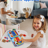 A smiling toddler girl is interacting with a blue felt busy book activity board in a bright indoor setting.