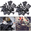 A collection of black self-tapping screws and U-shaped spacers used for automotive or mechanical repairs.
