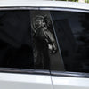 Close-up view of a black horse decal applied to the B-pillar window of a white car.
