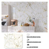 Marble effect peel and stick wallpaper applied to a kitchen cabinet and countertop.