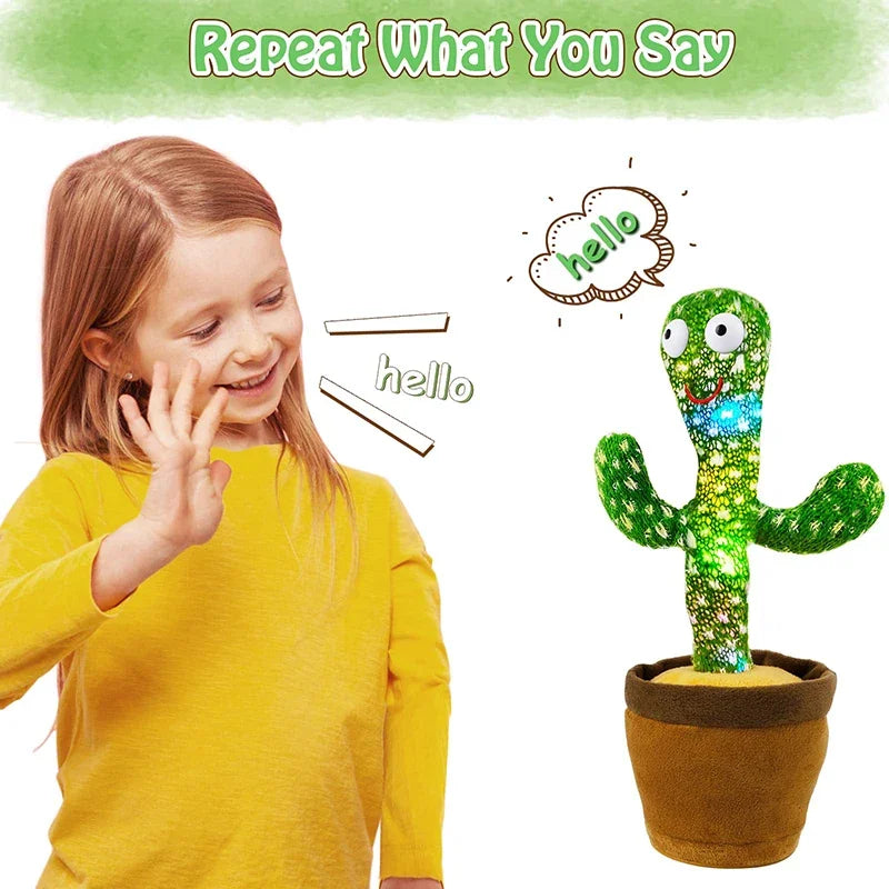 A young girl is demonstrating saying hello while a green cactus plush toy repeats the word hello.
