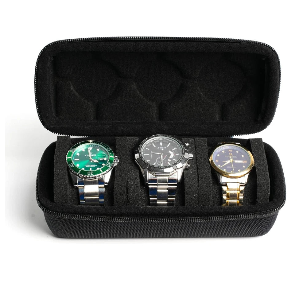 A black portable leather watch travel case with soft lining holding three wristwatches.