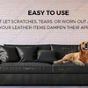 A dark gray sofa with a leather-like finish is shown in a brightly lit room, emphasizing its easy-to-use surface.