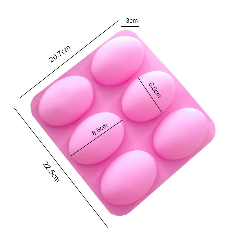 A pink silicone mold with six oval cavities for soap, baking, and DIY crafts.