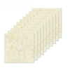 A stack of rectangular, light beige marble peel-and-stick wall tiles shown at an angle.