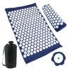 A dark blue acupressure mat, a matching pillow, and a black storage bag for pain relief.