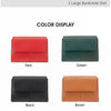 A variety of red and green tri-fold wallets displayed in different colors like black, brown, purple, and wine red.