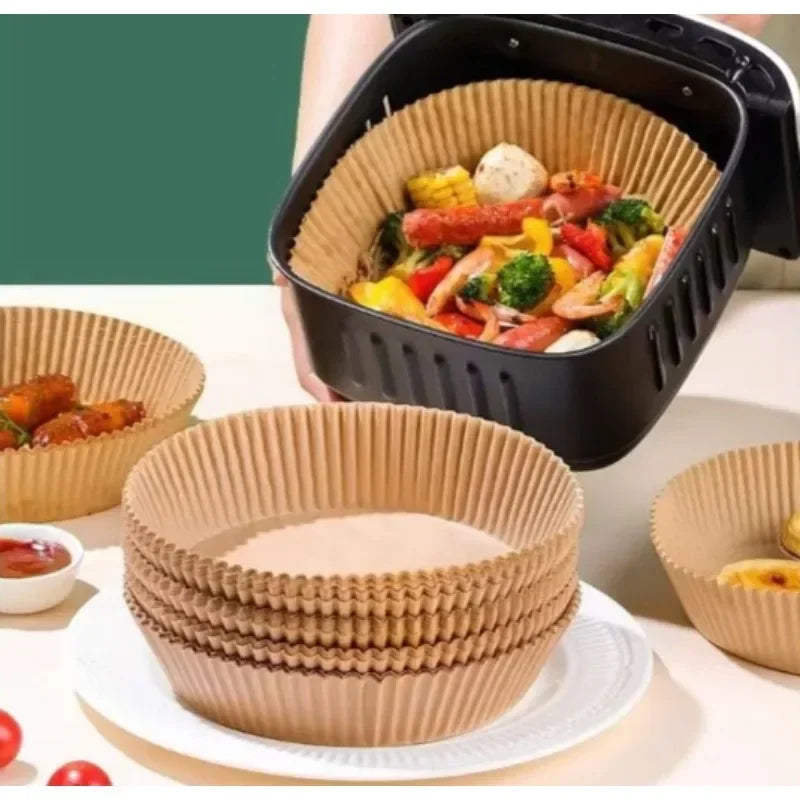 Disposable air fryer parchment paper liners in various sizes and a black air fryer basket