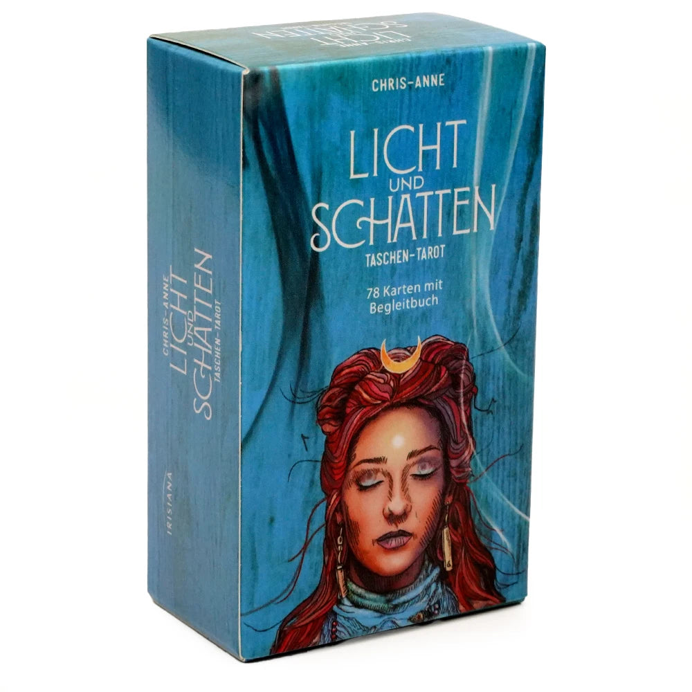 A box of the Licht und Schatten Tarot deck with a guidebook featuring a woman's face.