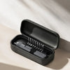 A black electric screwdriver in its open case showing multiple screwdriver bits.