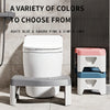 A white toilet with a gray squatting stool and agate blue and sakura pink color options displayed against a dark background.