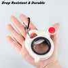 A hand holds a white fluorescent cable tie with a black ring and red cap, demonstrating its size and durability.
