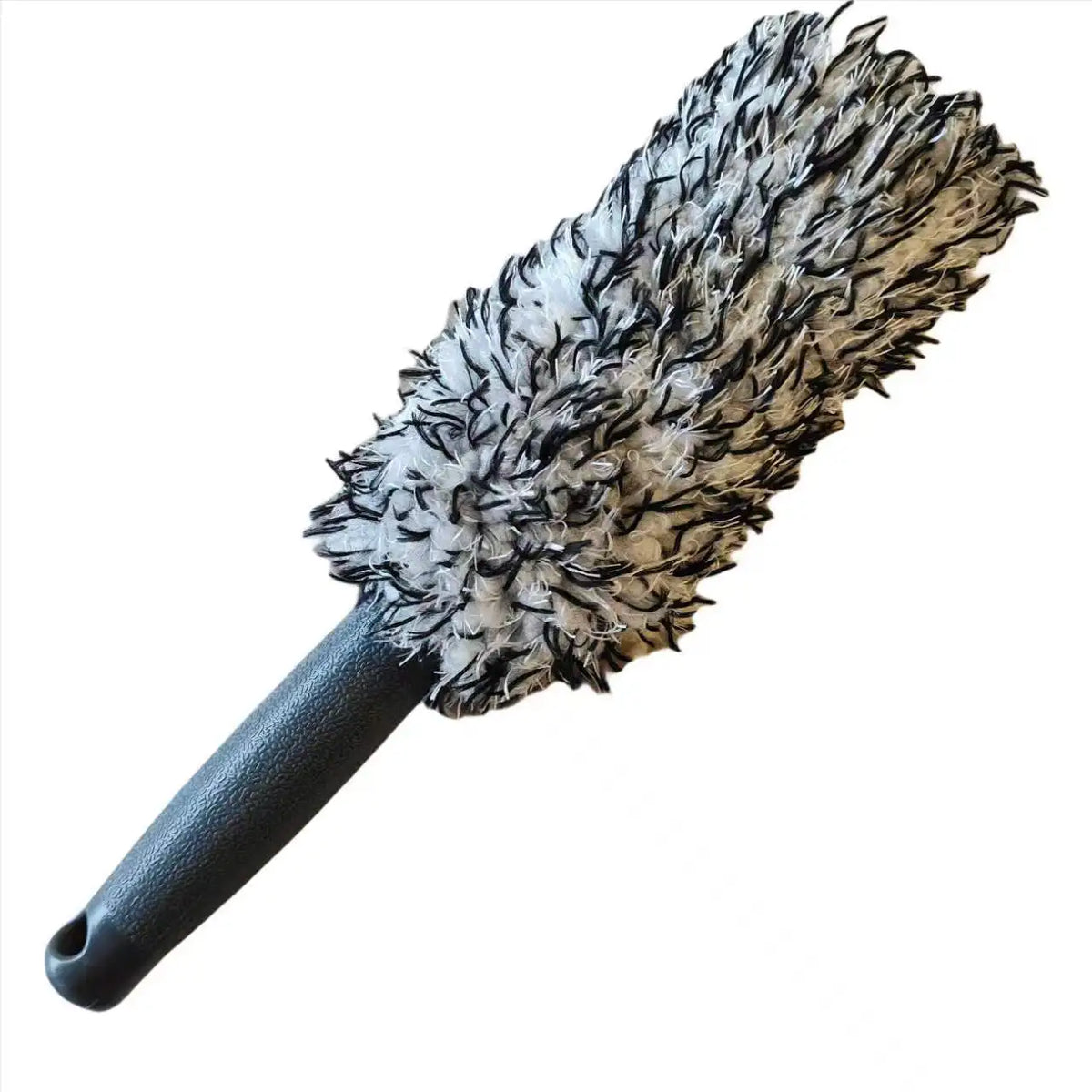 A black cleaning brush with a dense, plush, fibrous head and an ergonomic handle.