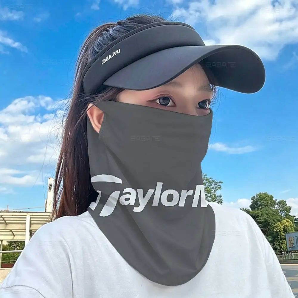 A person wearing a gray multifunctional neck gaiter and cap against a blue sky backdrop.