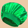 A vibrant green satin wide brim shower cap is shown from above.