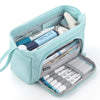 A light blue pencil case with a drawstring closure showing various pens and markers inside.