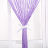 Purple beaded thread curtain tied with a white ribbon hanging vertically.