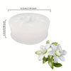 White silicone mold with a flower design for chocolates, candy, and fondant