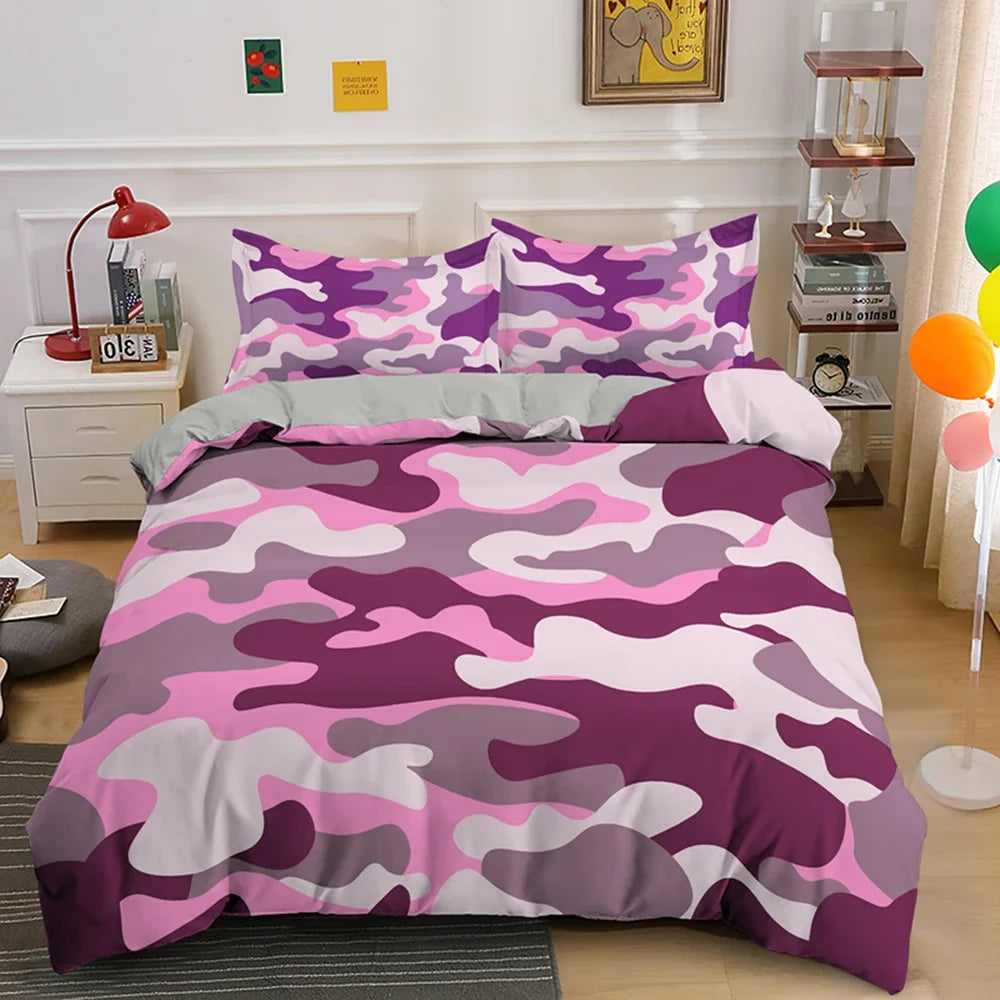 A purple and pink camouflage duvet cover set displayed on a bed with white nightstands and wooden shelving.