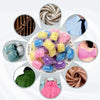 A collection of colorful water-soluble laundry fragrance beads in various shades and textures.