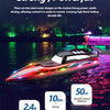A red and black high-speed RC speedboat with LED lights is shown on the water at night.
