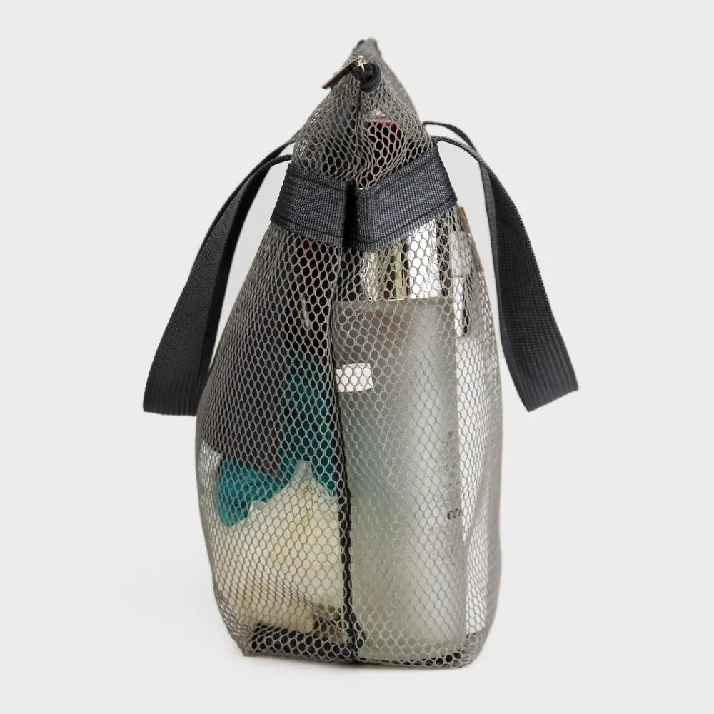 A mesh hanging toiletry bag with black straps and a clear pouch is shown against a white background.